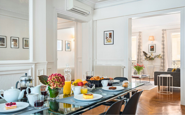Dining room of Parisian apartment with French pastries.