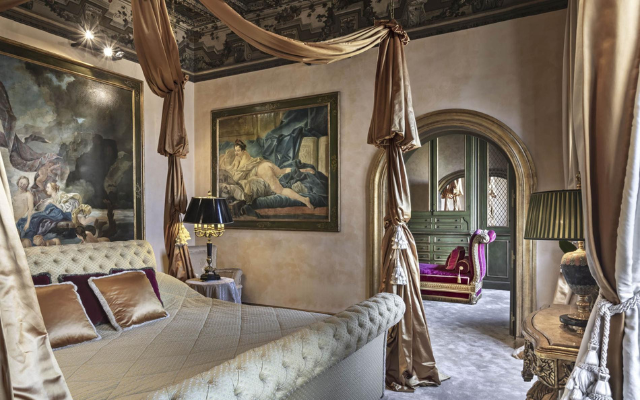 Palatial-style bedroom with opulent Roman design